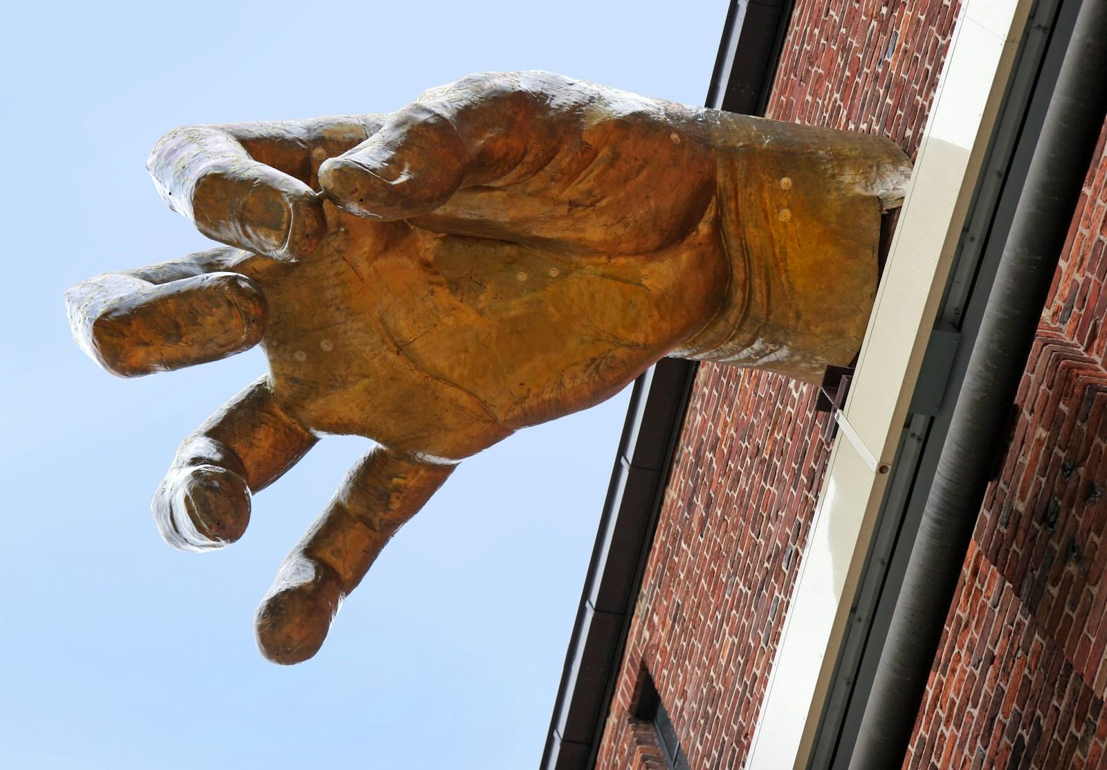 The giant golden hand sculpture on AVAM's Jim Rouse Visionary Center