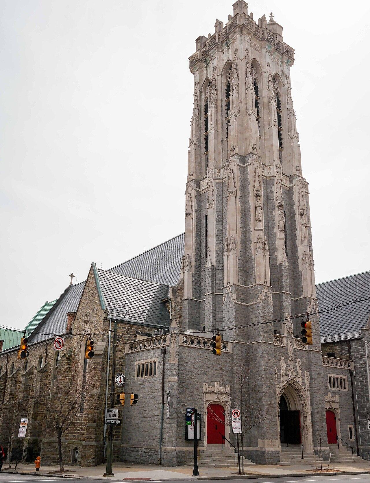 Emmanuel Episcopal Church on Cathedral Street, its tall carved stone tower over red doors