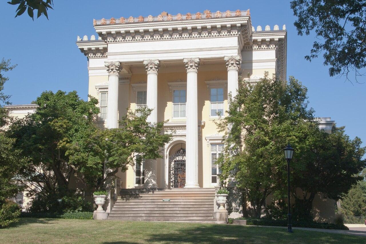 Evergreen House on North Charles Street, a yellow mansion with a tall columned portico and steps