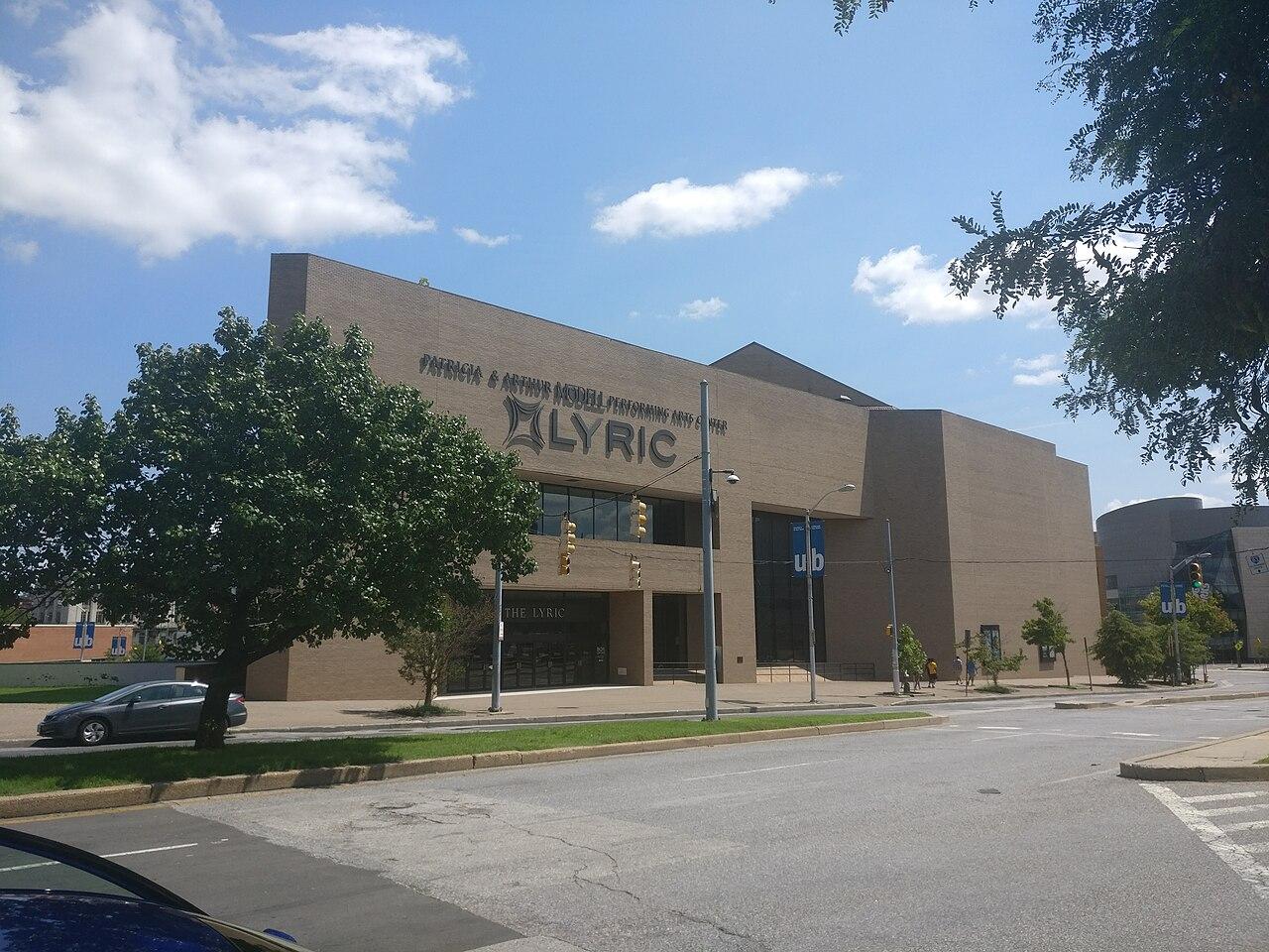 The Lyric on Mount Royal Avenue, a long tan block with LYRIC across its front, photographed in 2017