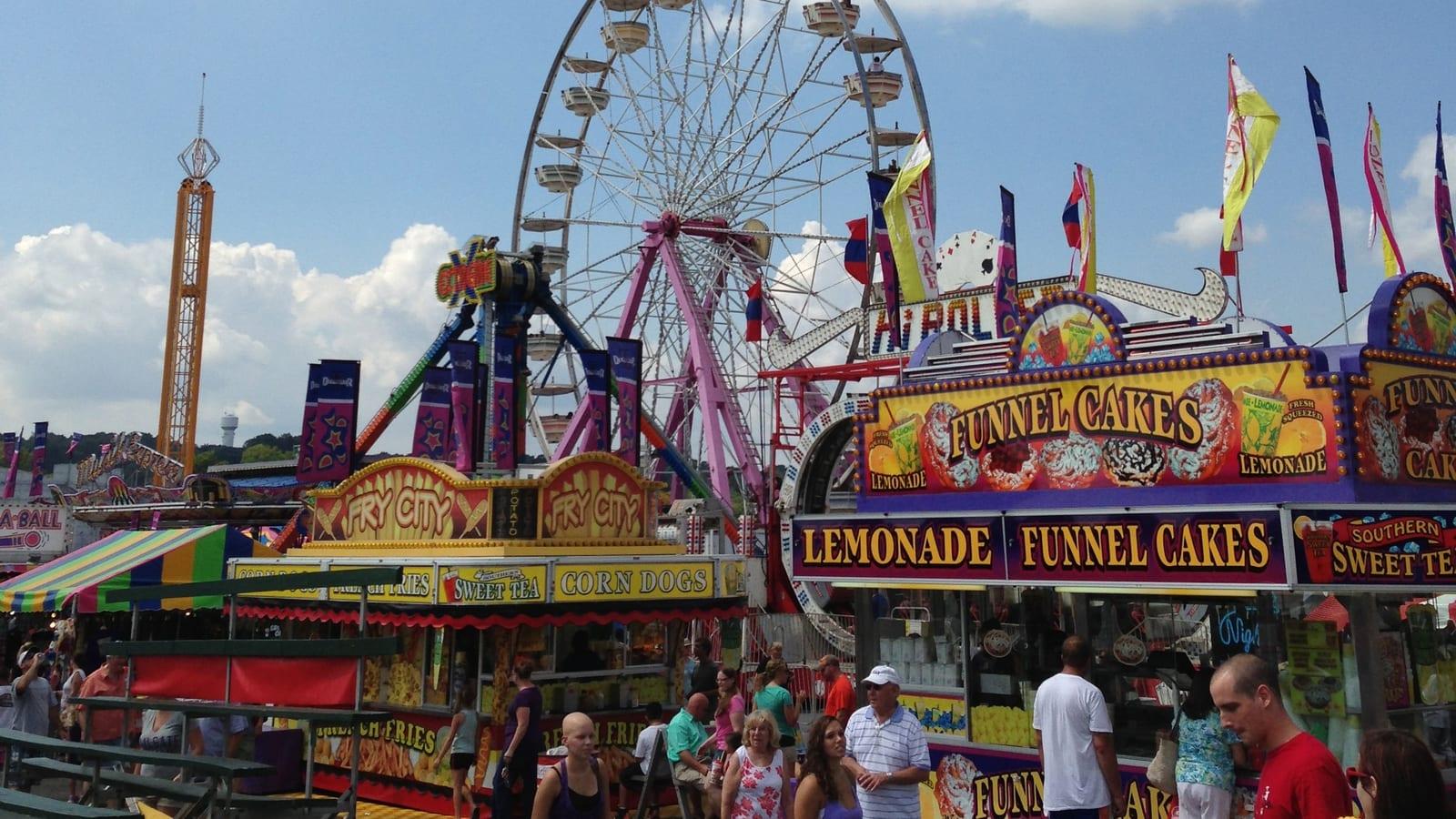 The midway at the Maryland State Fairgrounds: the ferris wheel over funnel cake and corn dog stands