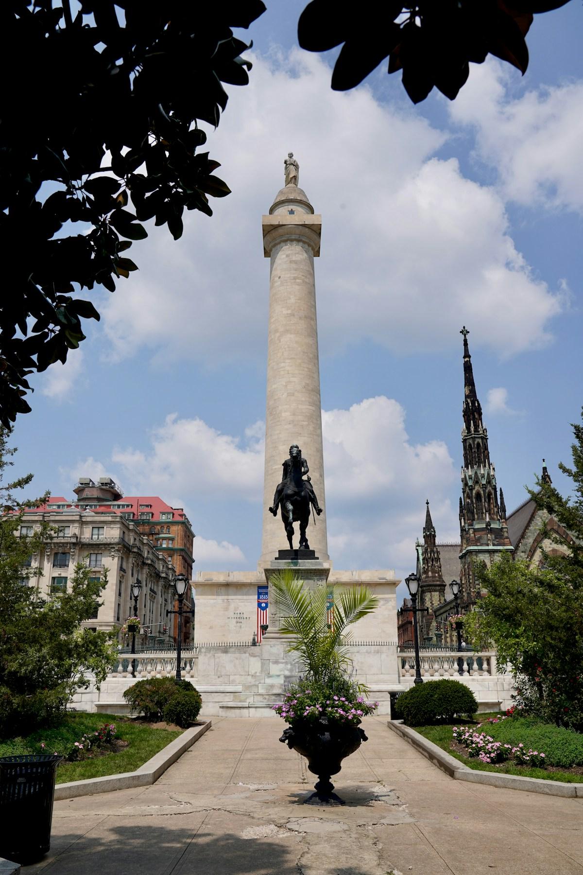 The Washington Monument rising over Mount Vernon Place