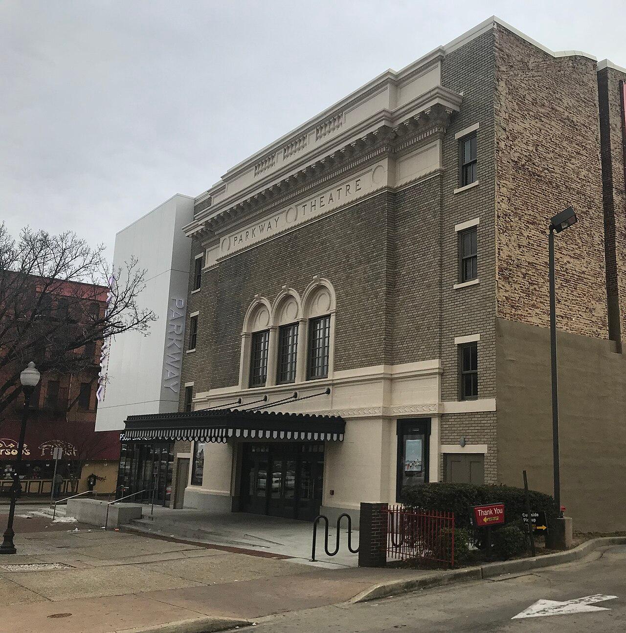 The Parkway Theatre of 1915 on North Avenue, restored, with PARKWAY THEATRE carved across the top and a striped awning over the doors