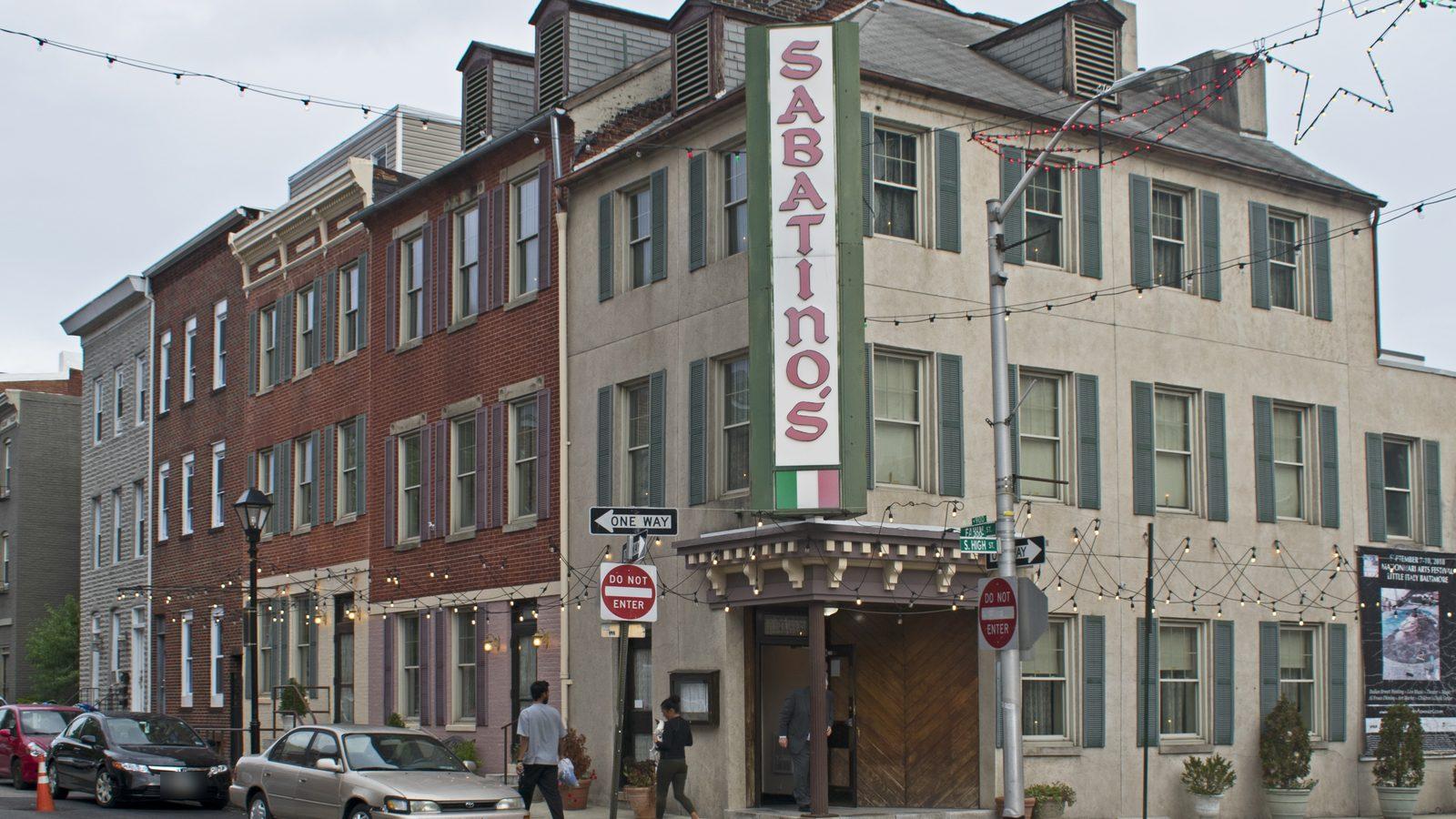 Sabatino's at 901 Fawn Street in 2023, its tall sign in red letters over an Italian flag above the corner entrance
